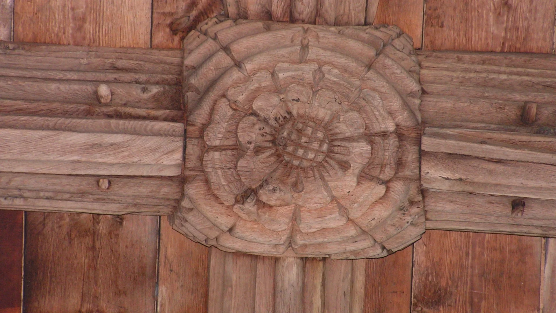 Wooden carving of a rose on the ceiling