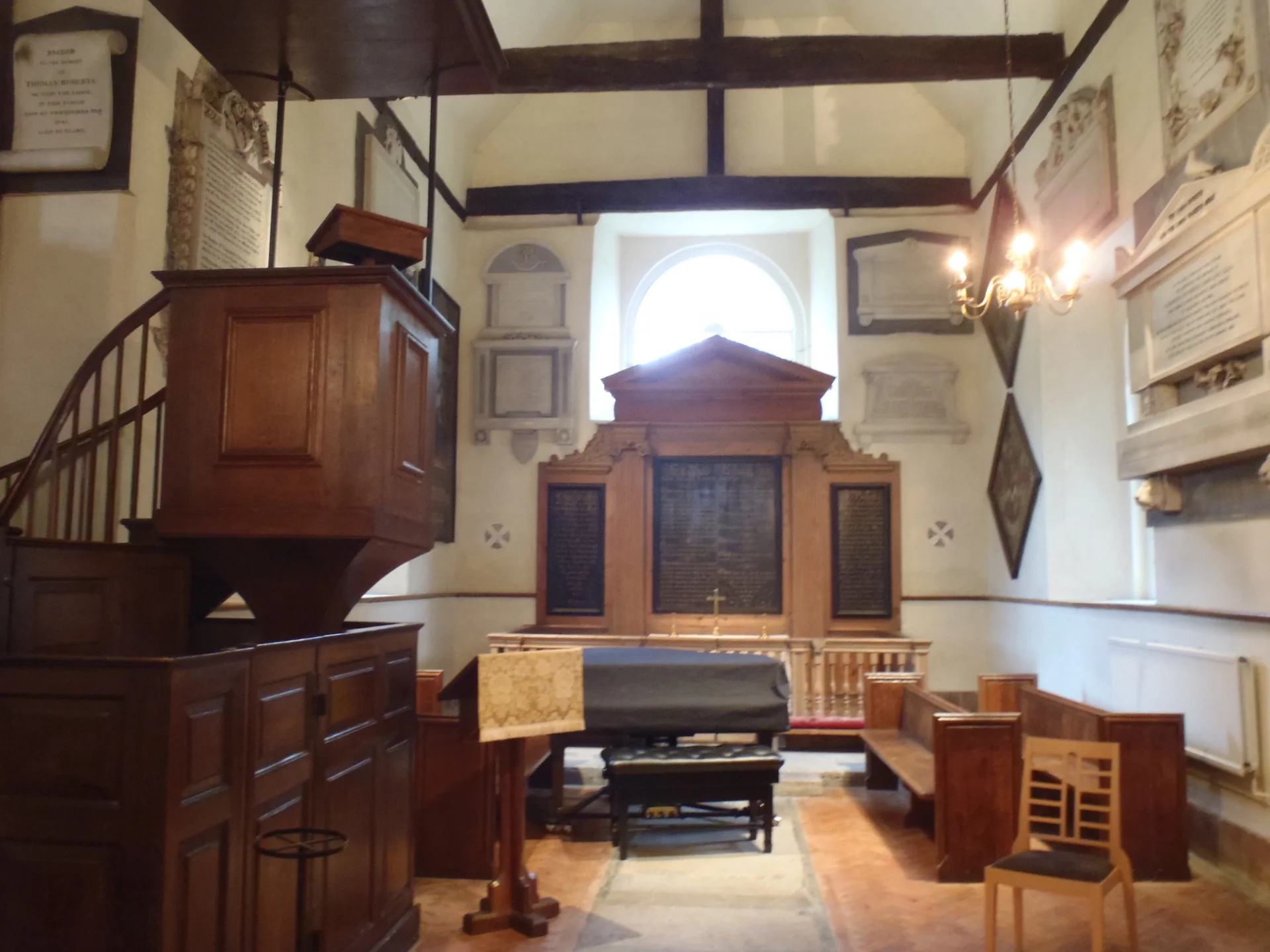 Eighteenth-century furnishings, three-decker pulpit, piano and wooden reredos with large plaques