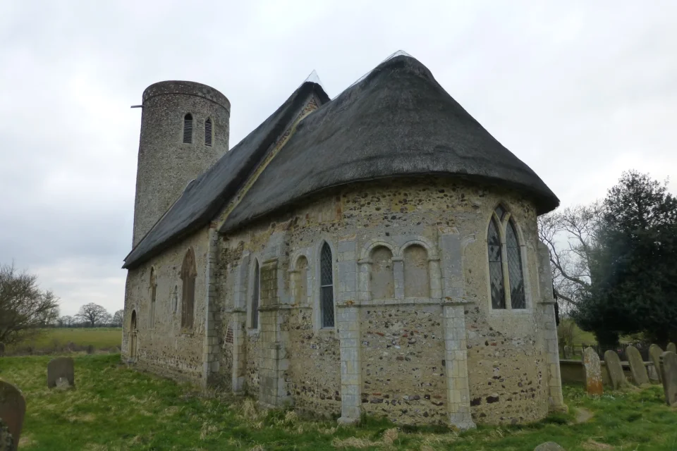 exterior with it's round tower and thatched roof