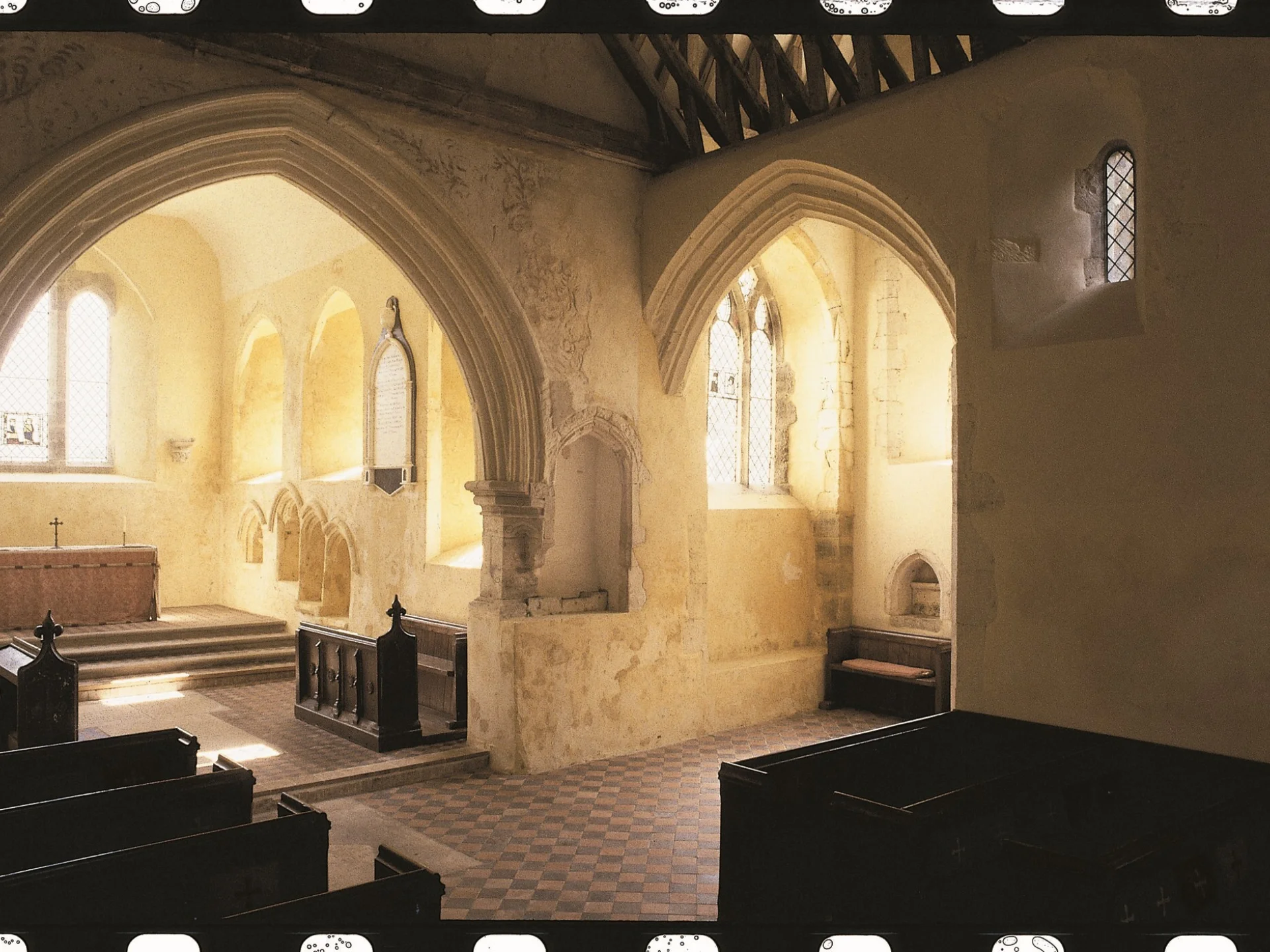 Image of the interior of the church with sunlight pouring through the window
