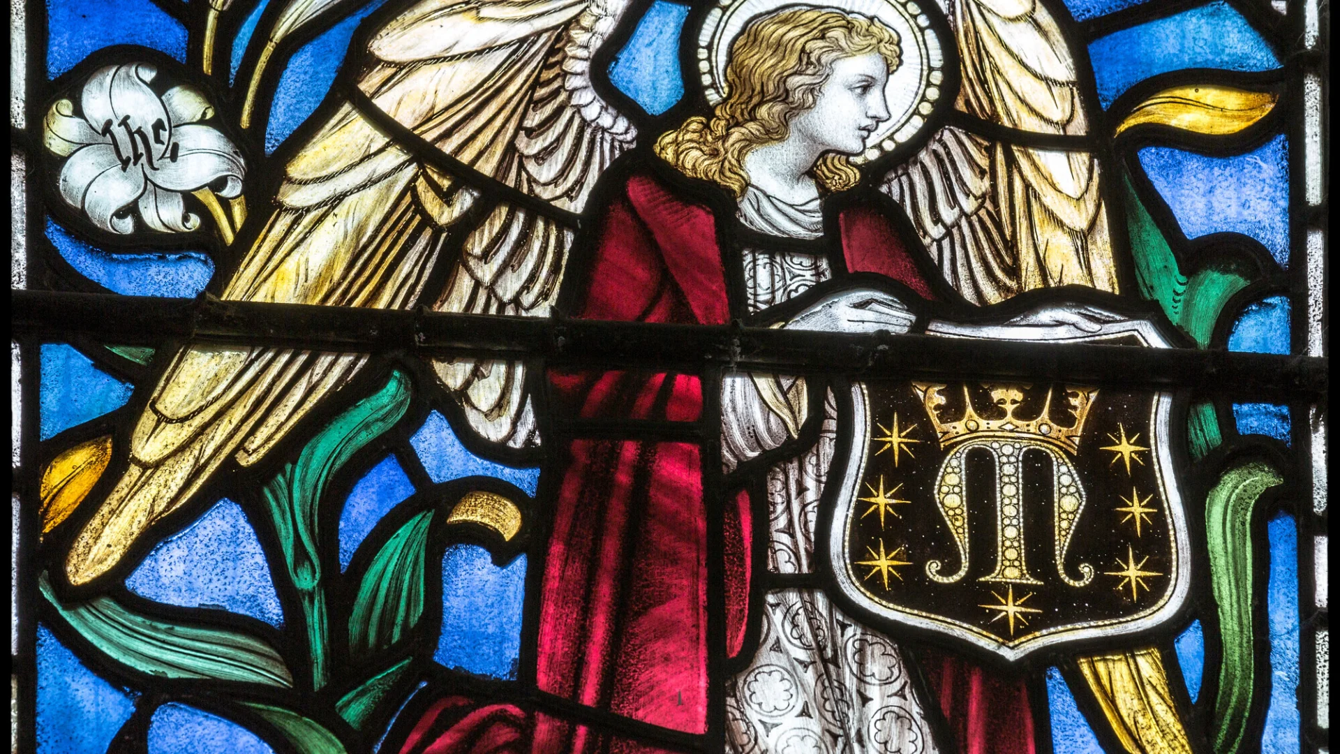 Stained glass featuring red, blue and gold