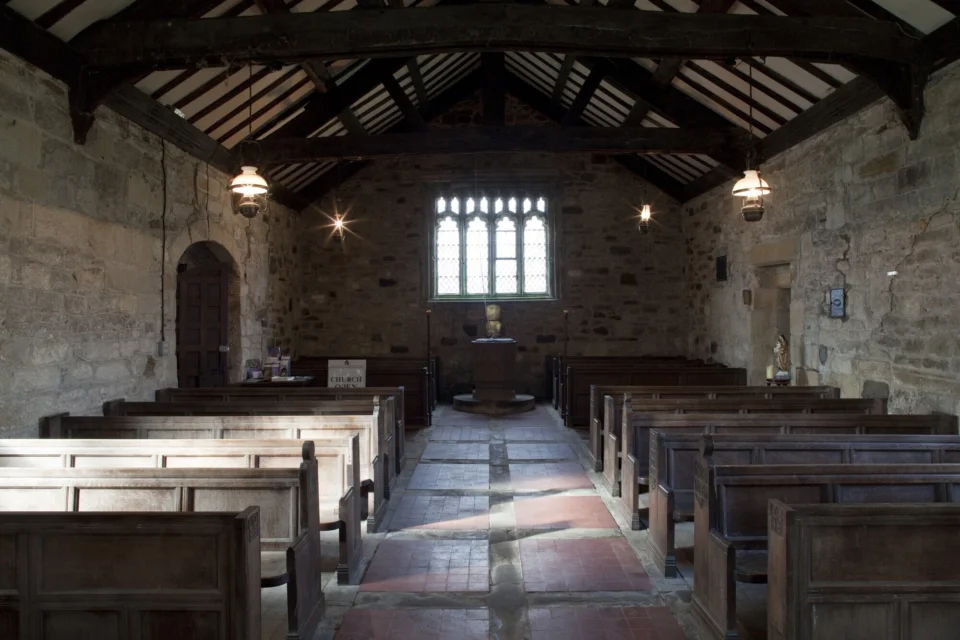 Image of the interior of the church with the altar the back
