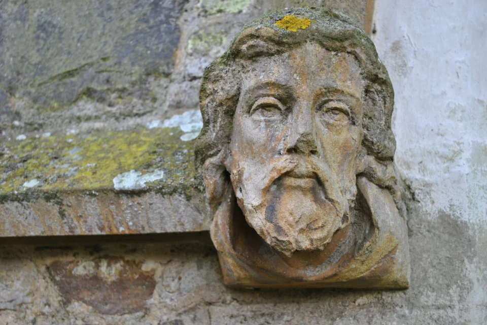 Stone carving depicting a human head