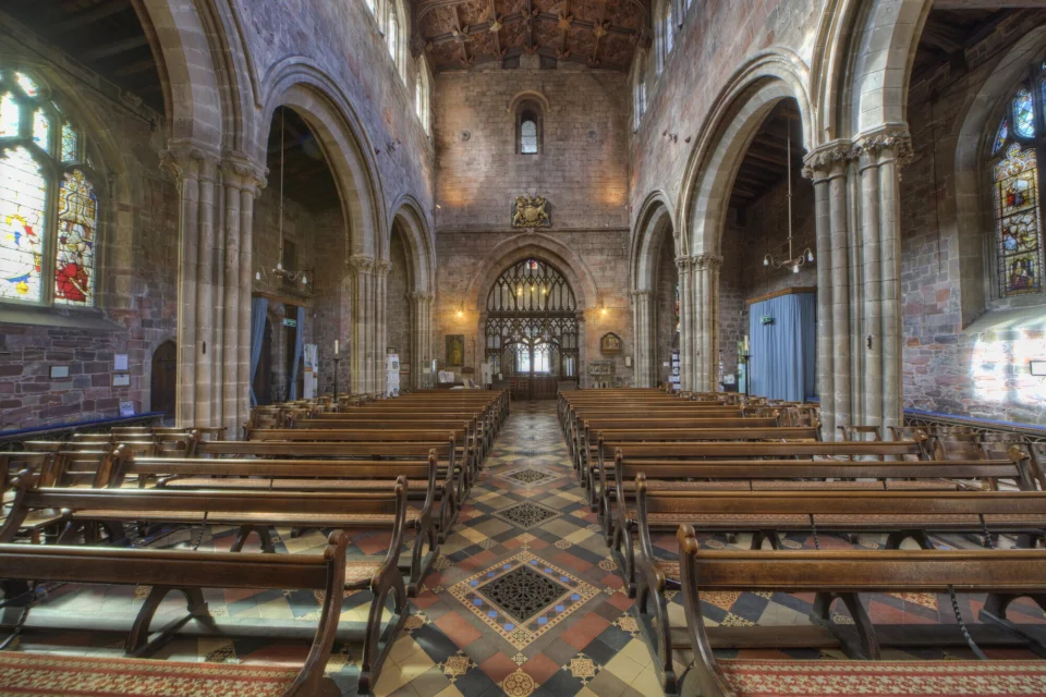 internal view of the exquisite ornate church with splendid stained glass windows, wood and stone carving throughout