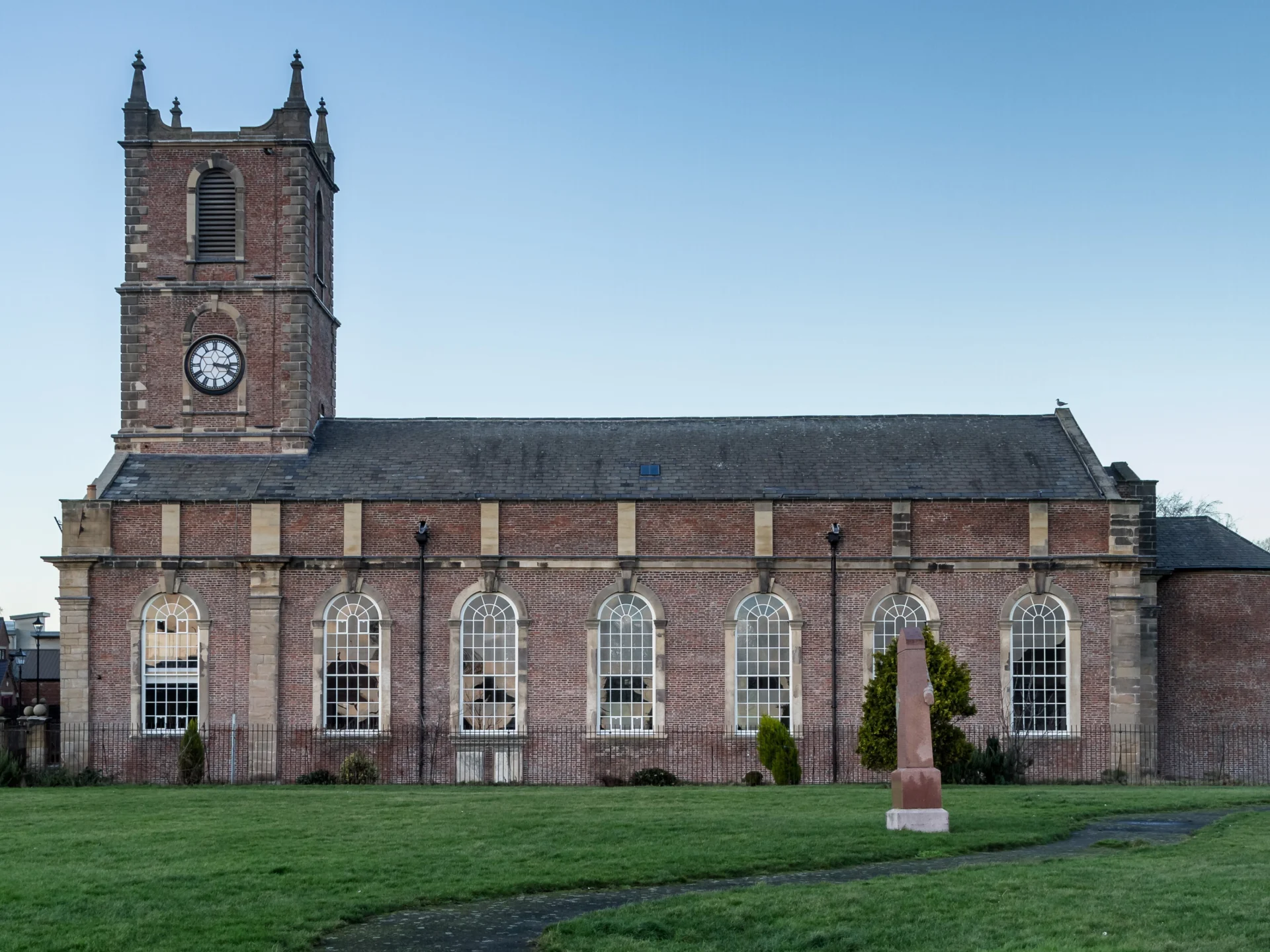 Side view of the exterior of this imposing stone built church