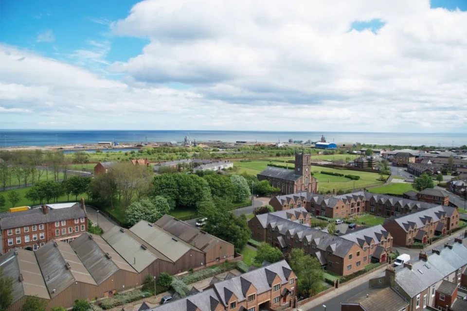drone view of Holy Trinity Church Sunderland from above, showing factory buildings and redbrick terrace buildings surrounding.
