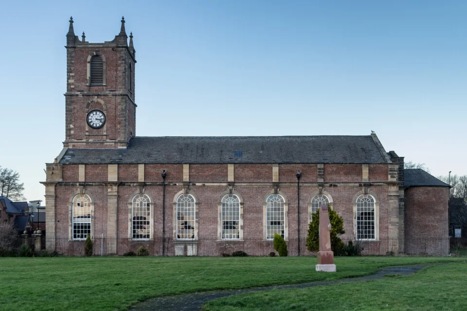 Side view of the exterior of this imposing stone built church