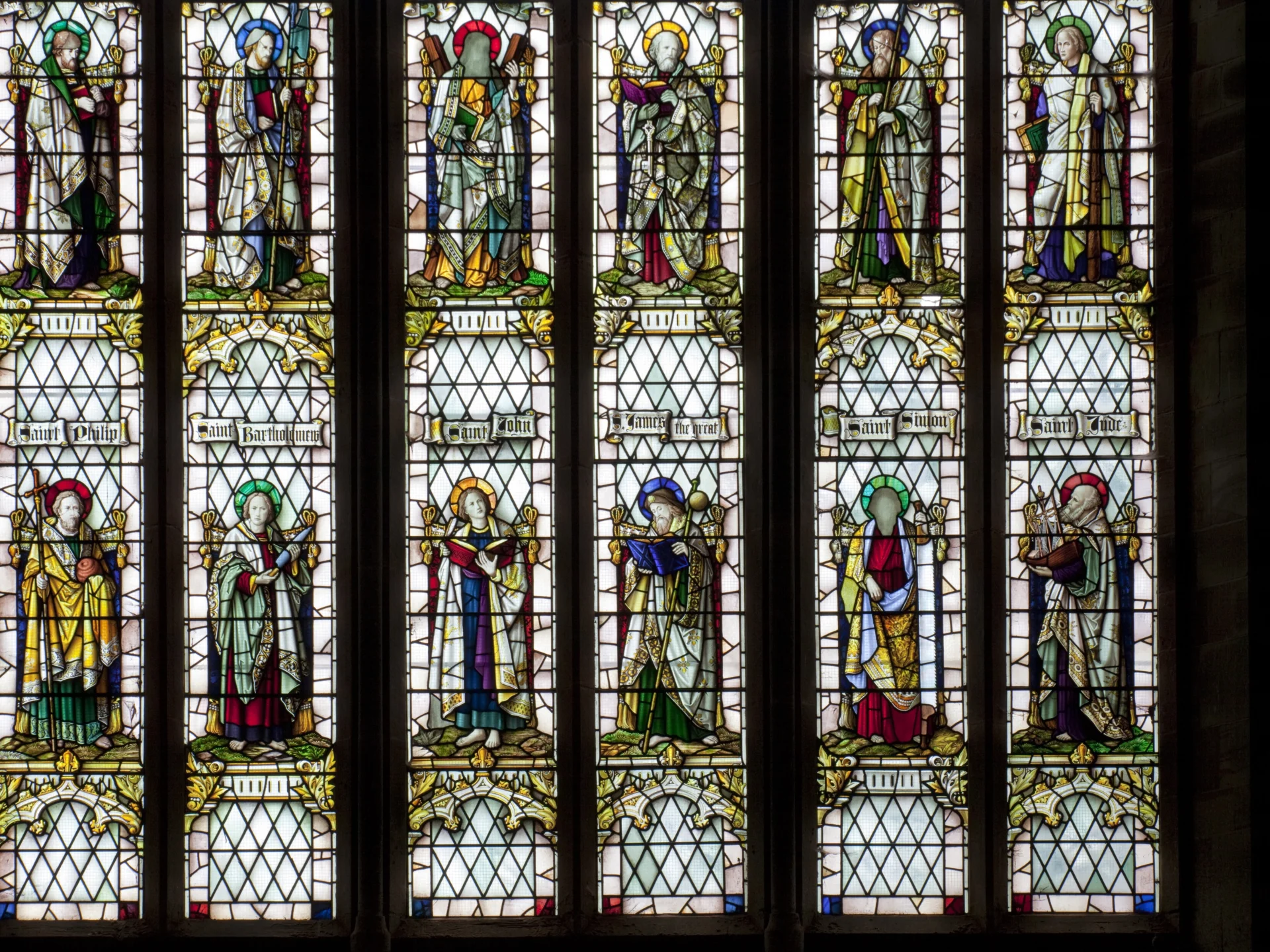 Colourful stained glass window depicting the twelve apostles