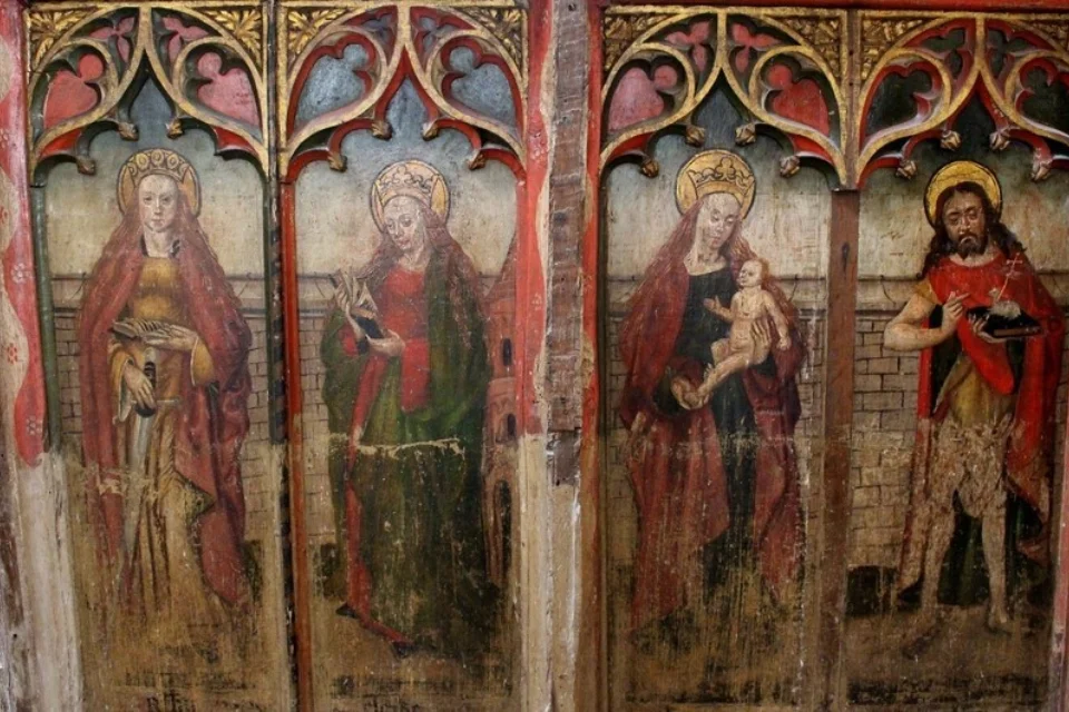 Image of the Rood Screen depicting saints on the four panels
