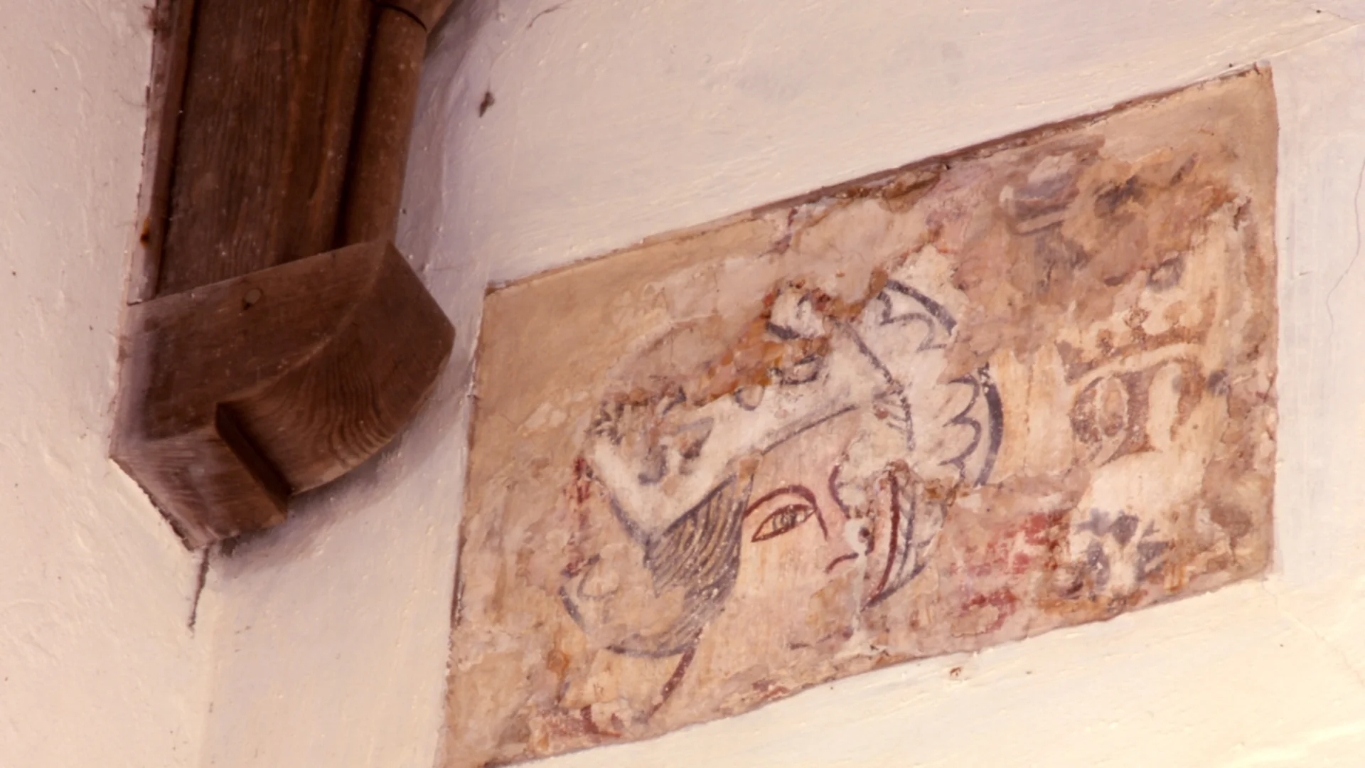 wall painting of a woman's head wearing a crown