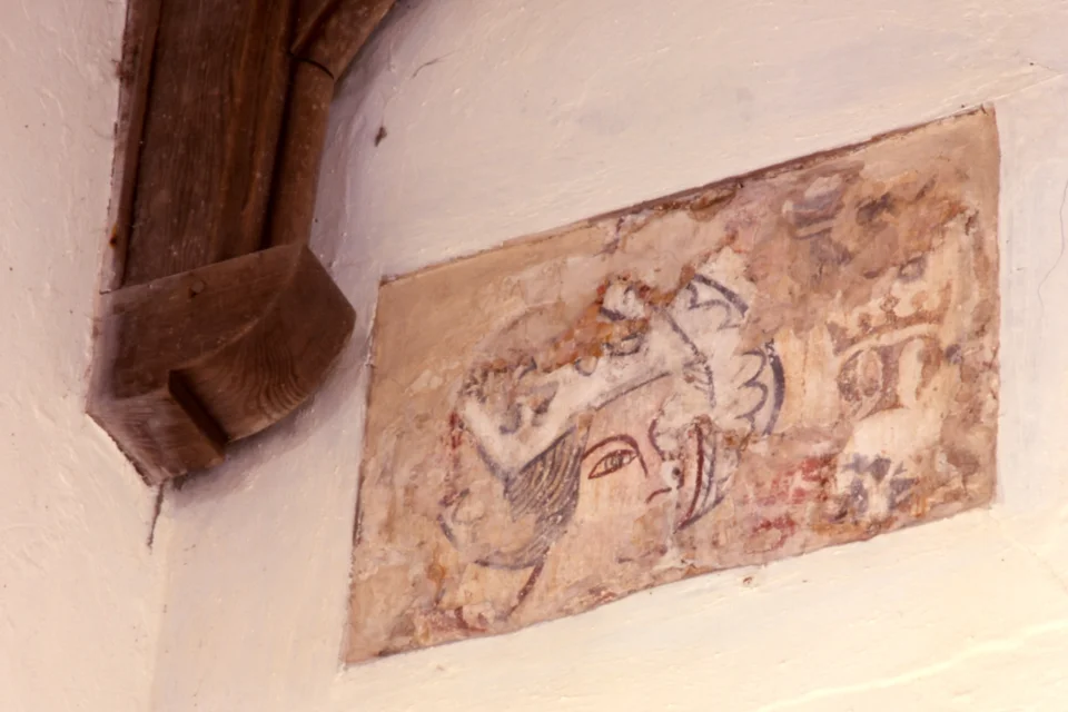 wall painting of a woman's head wearing a crown