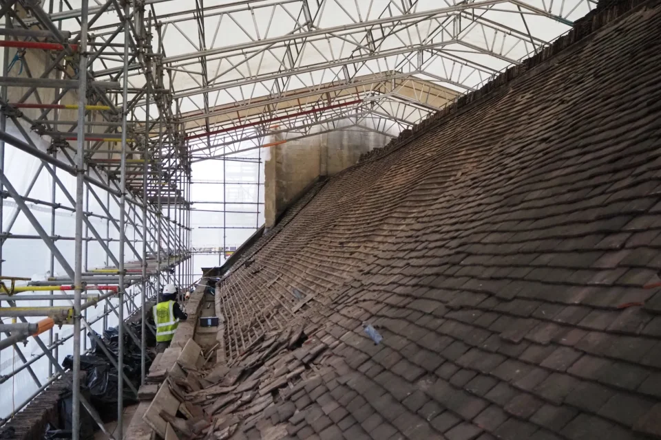 St Swithun's roof with fallen tiles surrounded in scaffolding