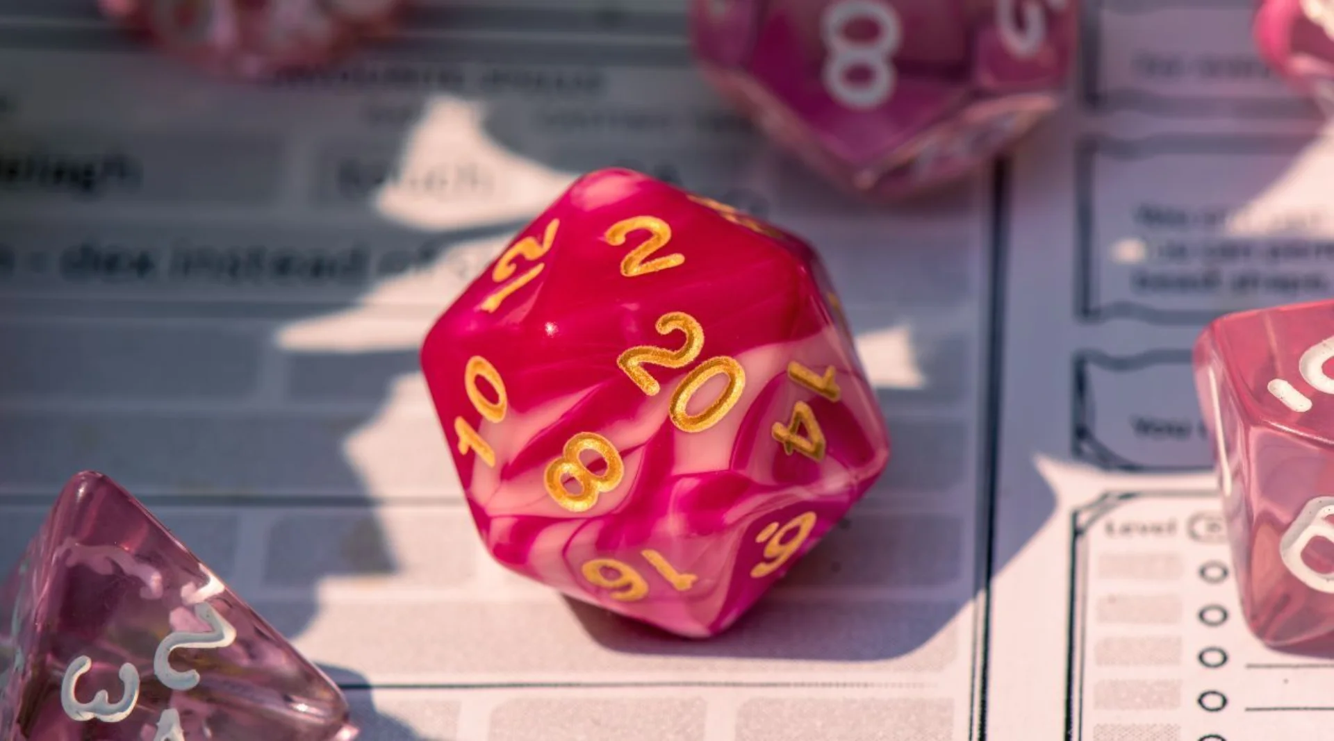Image of d20 (20 sided dice) on a character sheet for the game dungeons and dragons