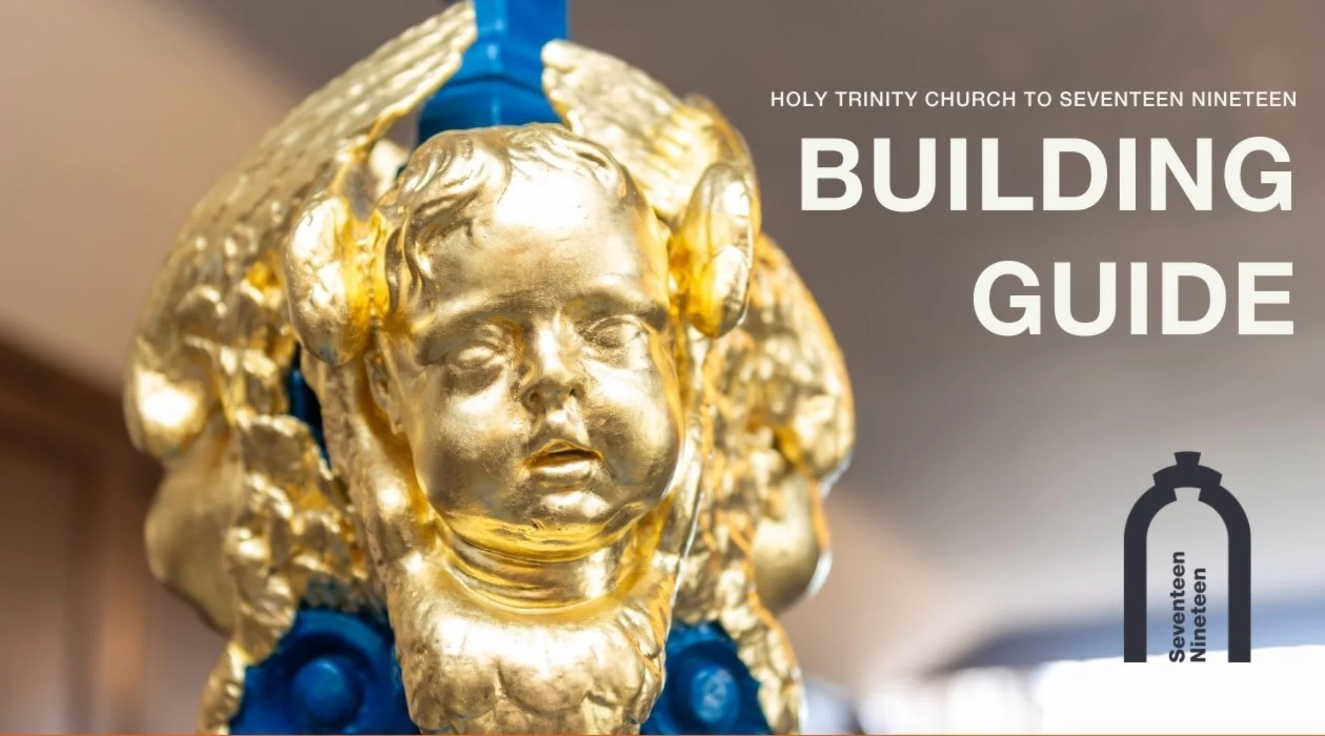 golden faces of cherubs at the base of a thin wooden column