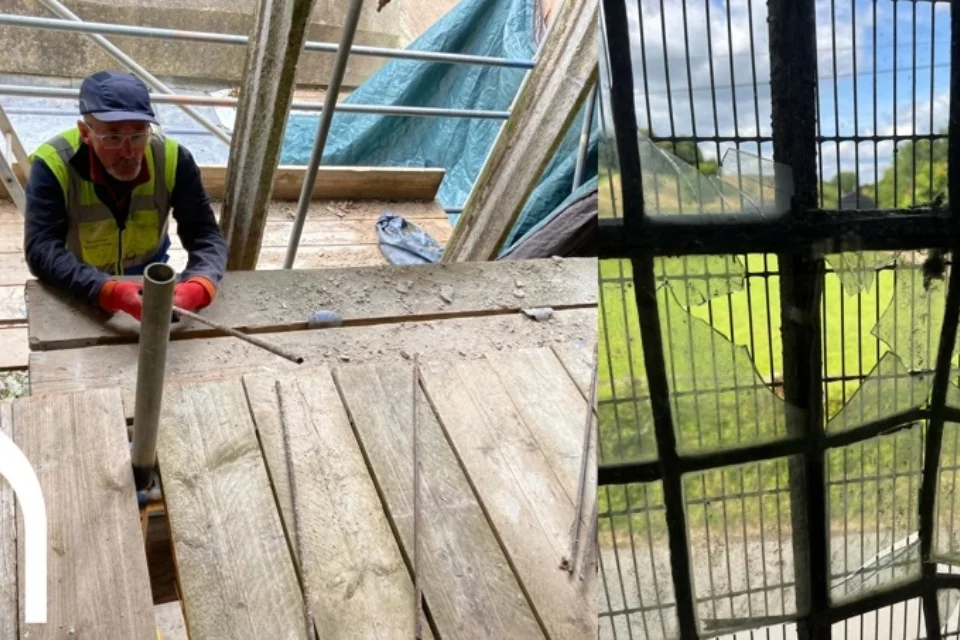 right hand side is a broken glass window, left hand side a builder in a baseball hat and high visability jacket sitting on scaffolding holding a pipe.